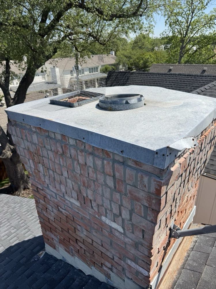 New custom-fabricated stainless chase cover installed on a Dallas–Fort Worth chimney chase