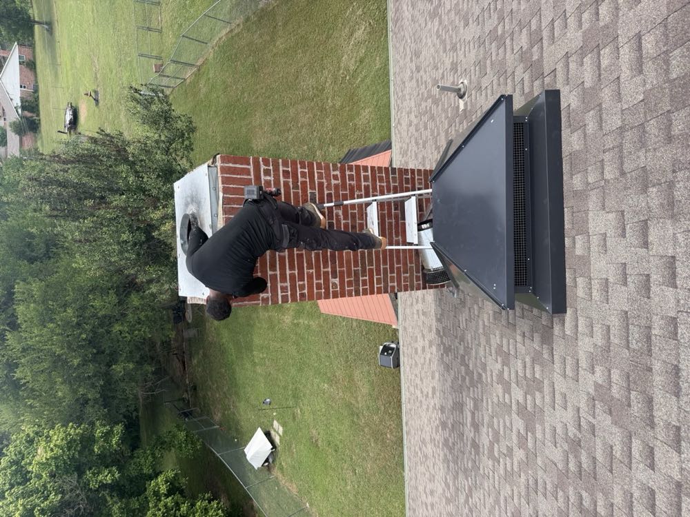 Texan Flue technician installing a custom chimney chase cover
