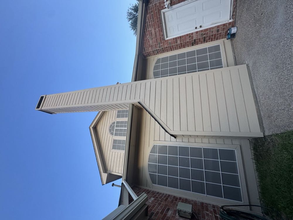 Finished siding-wrapped chimney chase on a Dallas–Fort Worth home