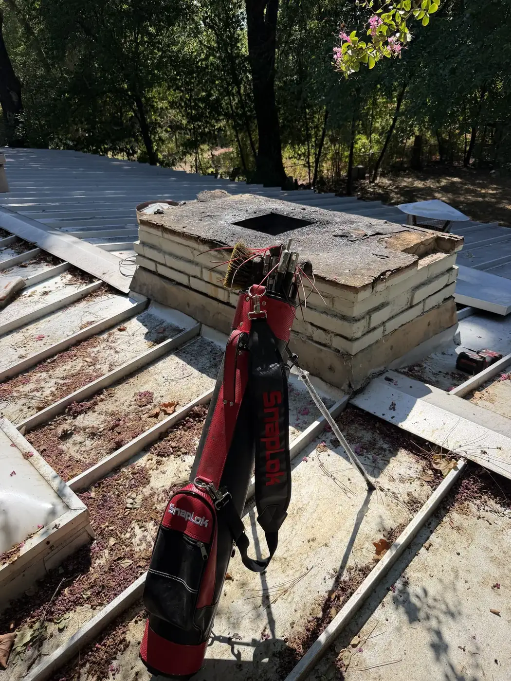 Rotary sweep rods worked down a chimney flue from the rooftop