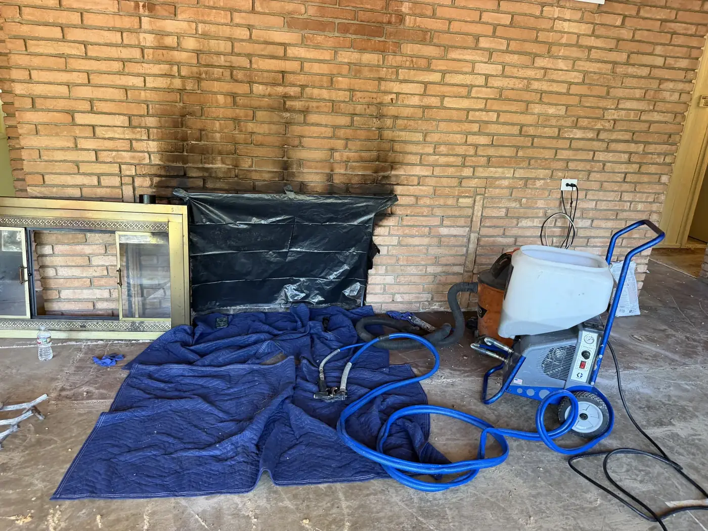Drop cloths and HEPA containment set up in a DFW living room