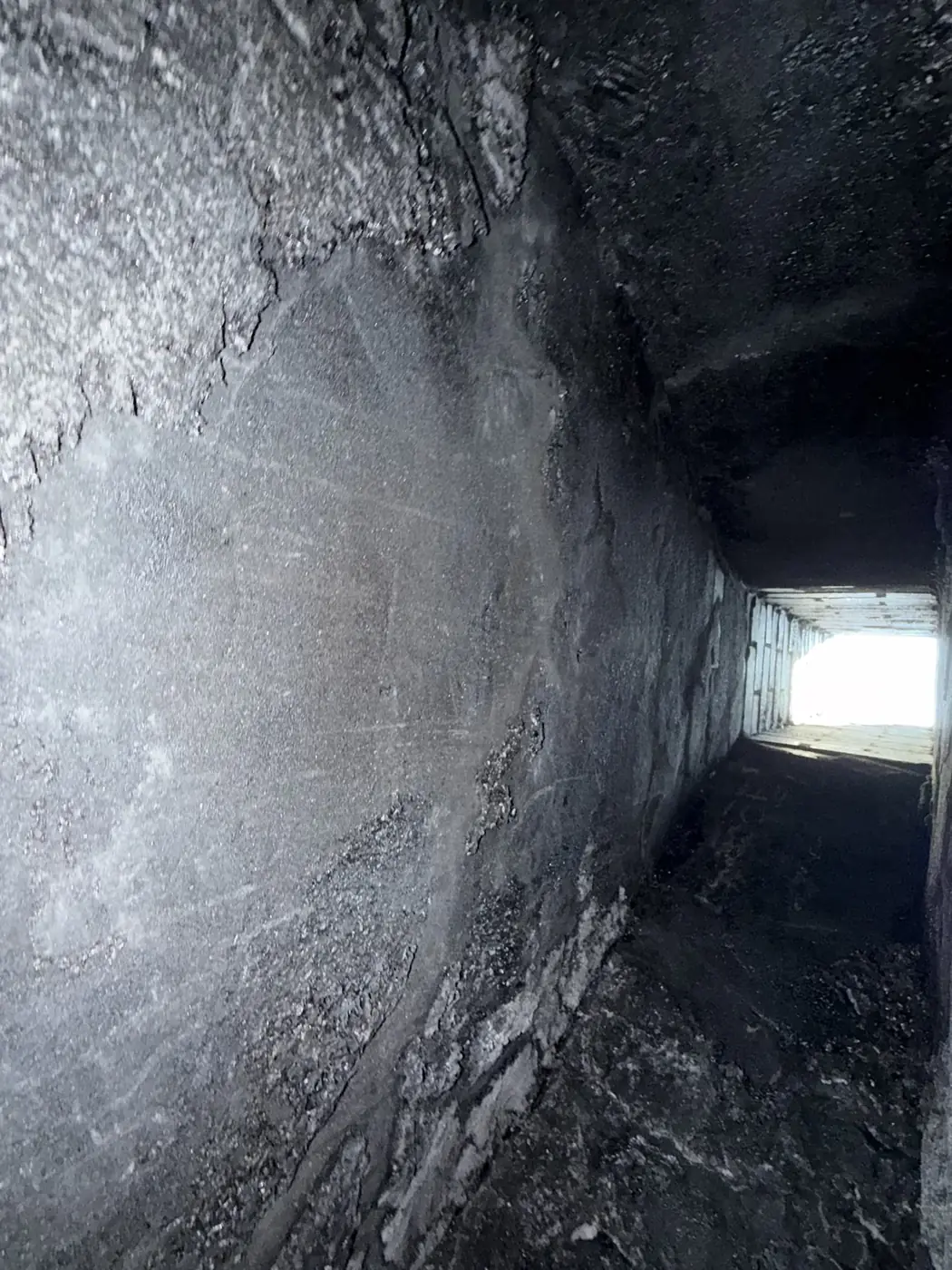 Camera view up a chimney flue interior during inspection