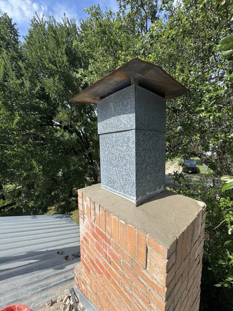Custom chimney cap with spark arrestor mesh installed in Dallas–Fort Worth