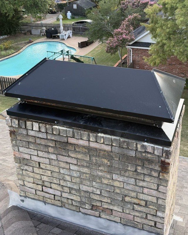 New black chase cover installed by Texan Flue on a Dallas home at golden hour