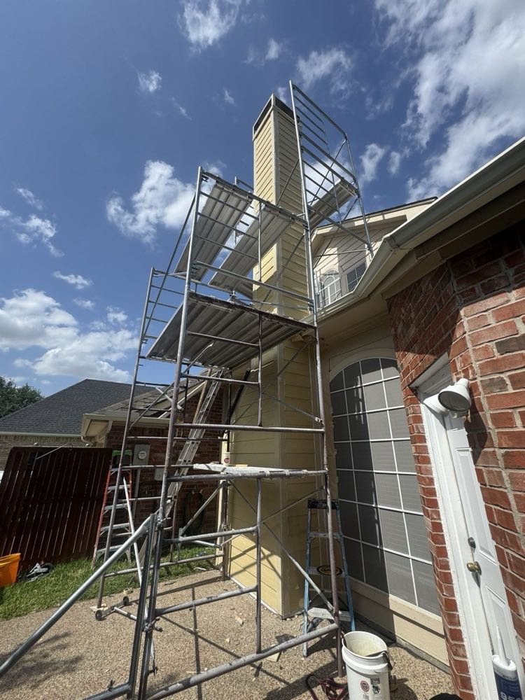 Scaffolding set for tuckpointing and mortar restoration on a North Texas brick home