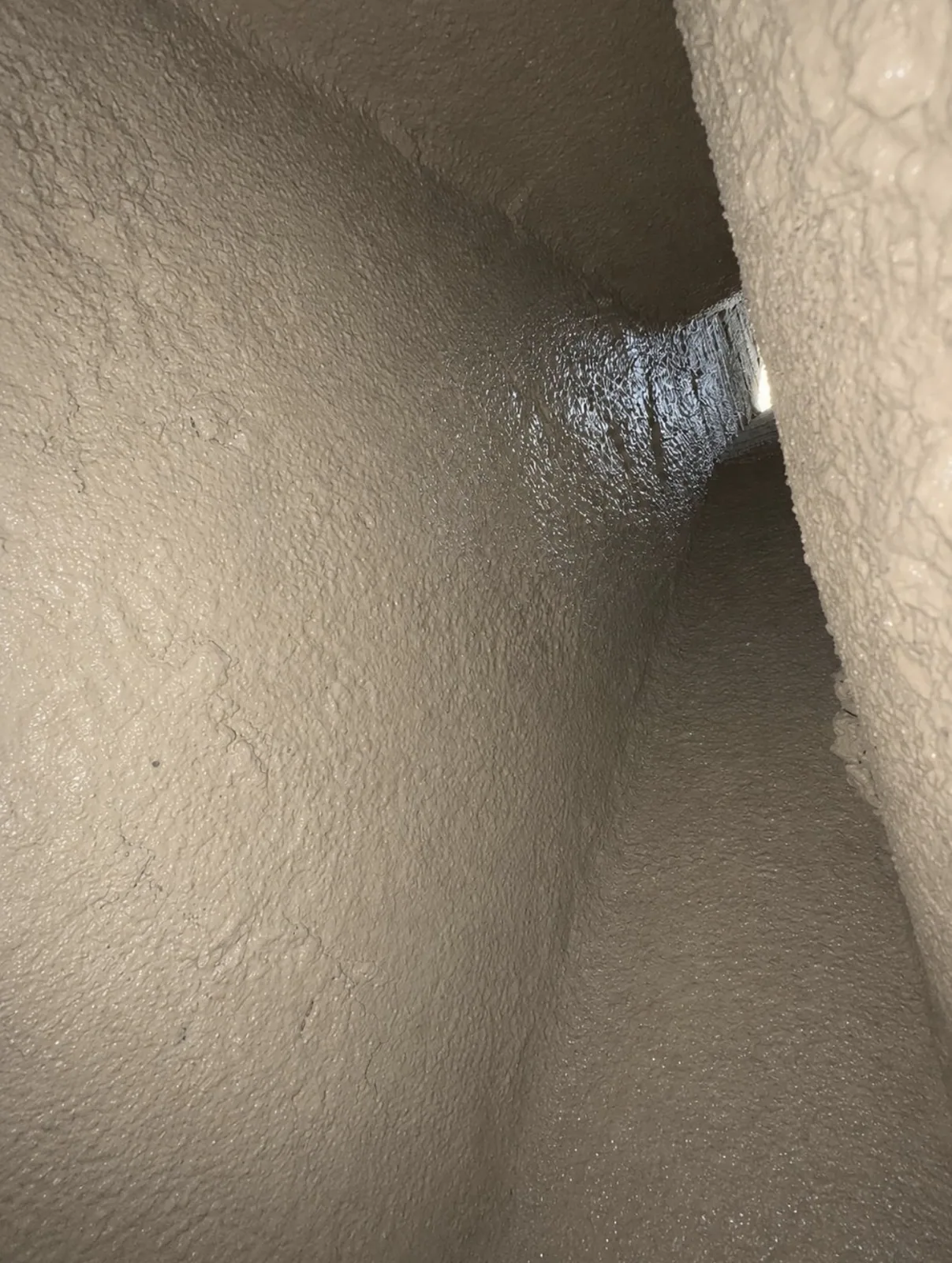 Smoke chamber parged smooth to NFPA 211 in a DFW fireplace