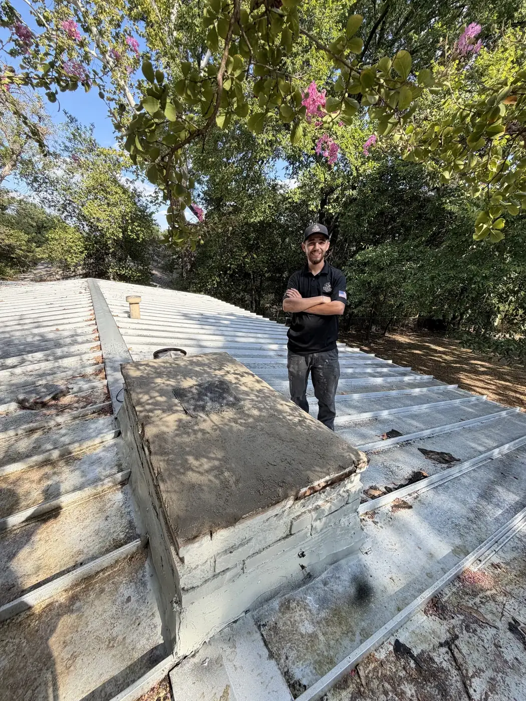 Texan Flue technician on a Dallas–Fort Worth rooftop beside a chimney